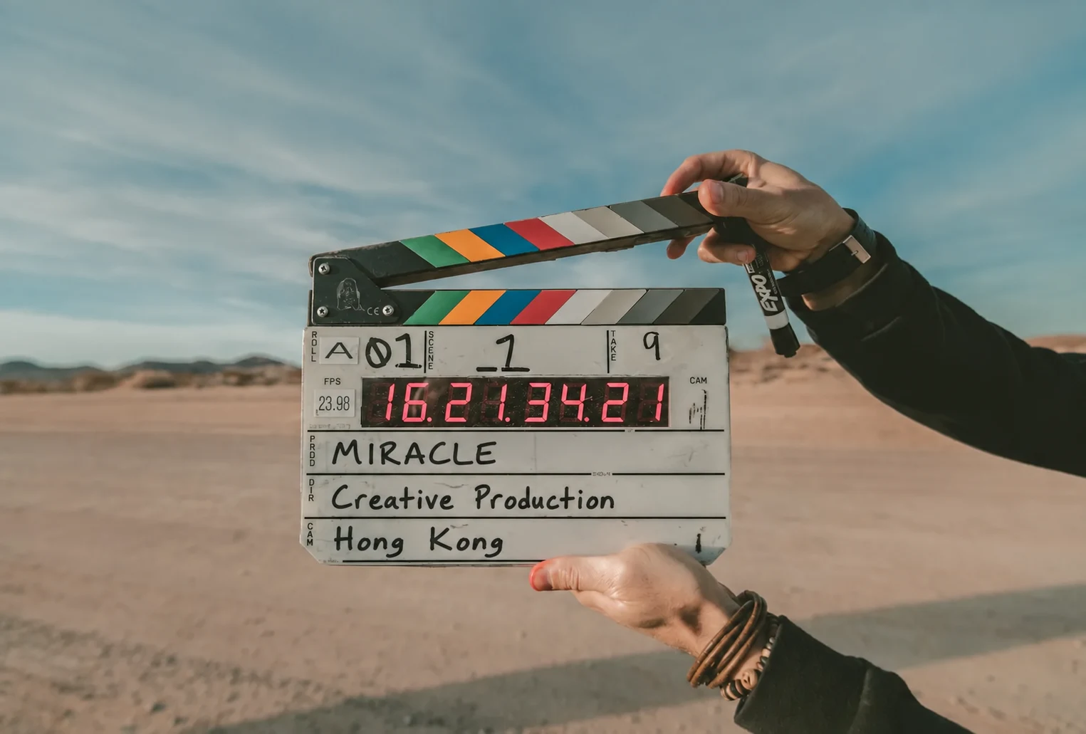 Miracle Creative Production clapperboard on a film set