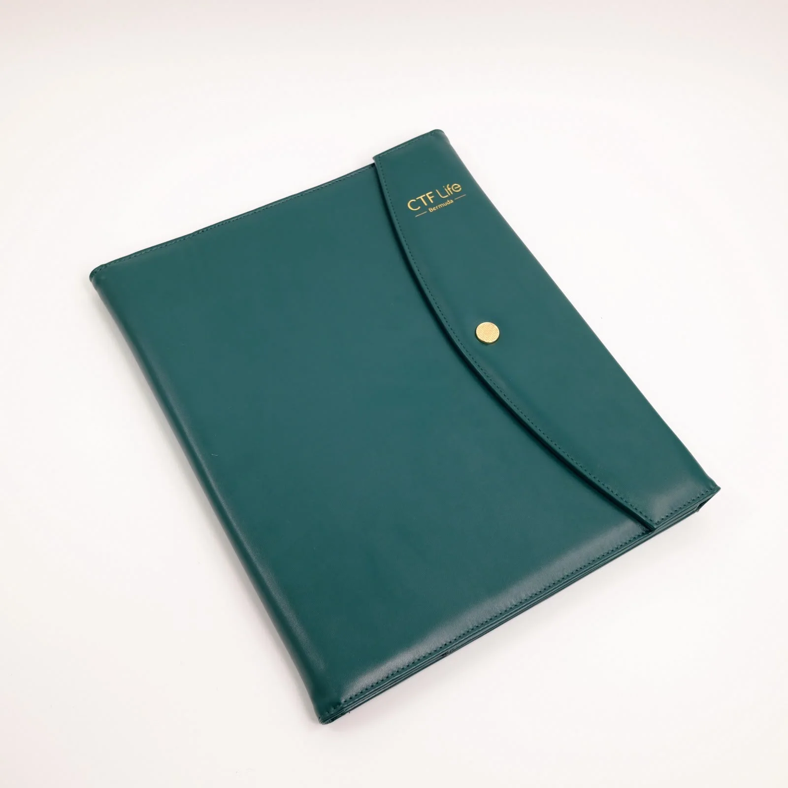 Green CTF Life branded document pouch with gold detailing