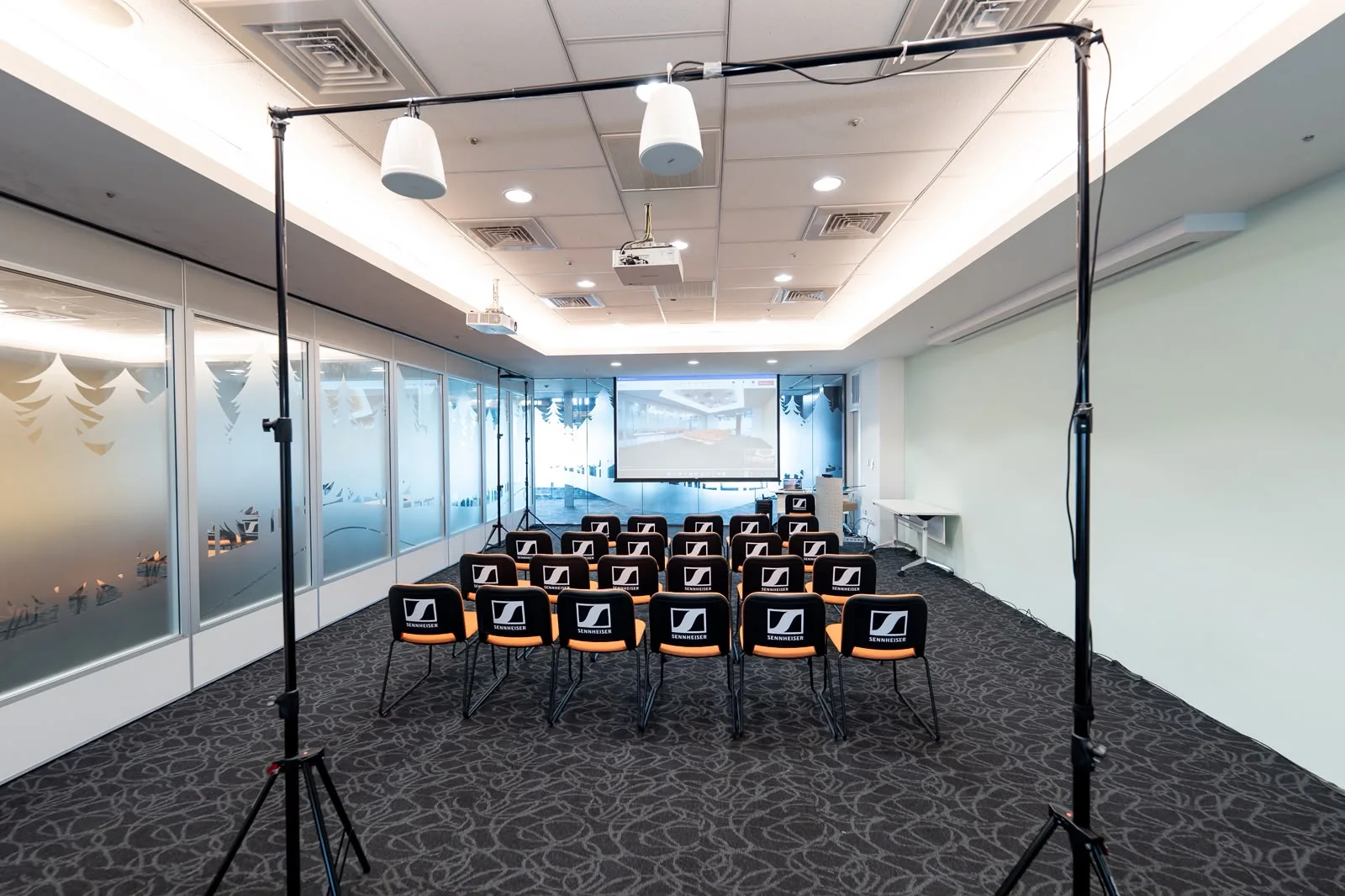 Suspended speakers and presentation equipment prepared in a Sennheiser breakout room
