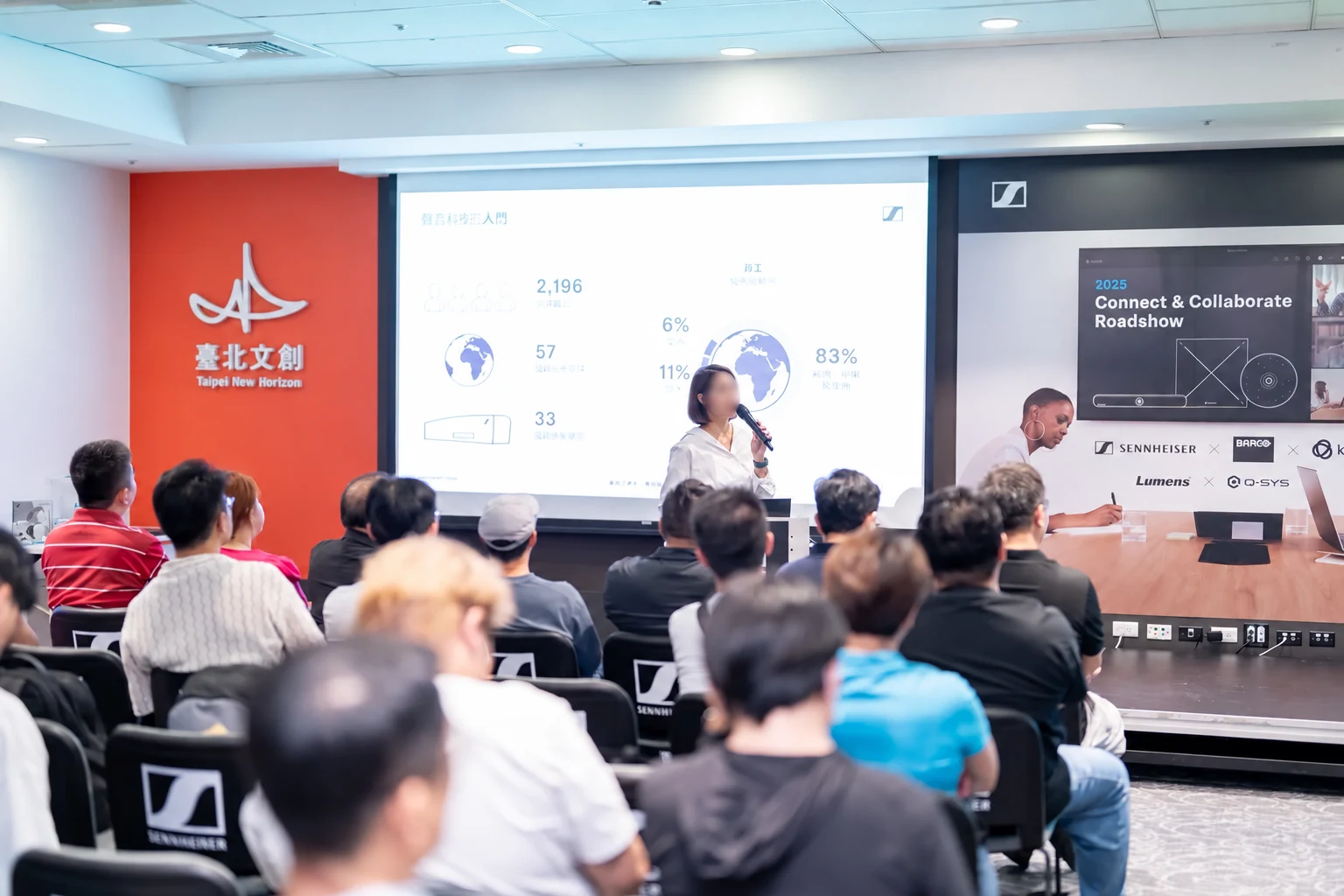Presenter addressing guests at the Sennheiser Connect and Collaborate Roadshow
